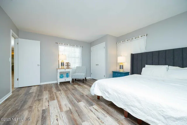 a view of a city with lush green forest