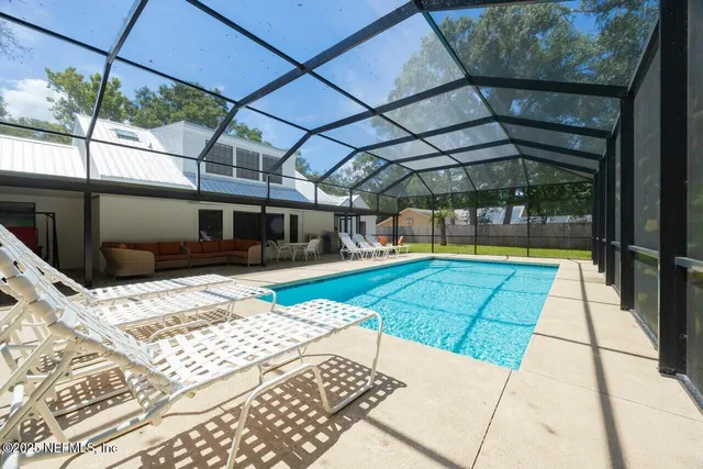 a view of a room with a porch and refrigerator