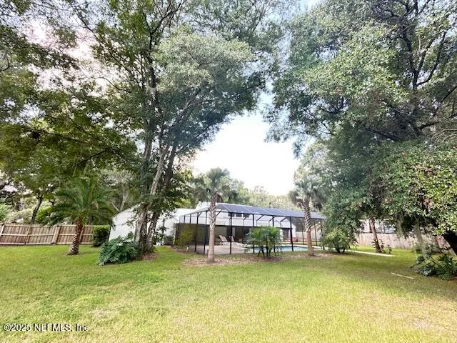 a room with a table chairs and entryway