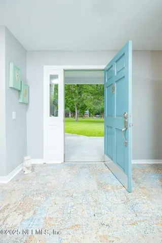 a kitchen with kitchen island granite countertop a sink cabinets and stainless steel appliances