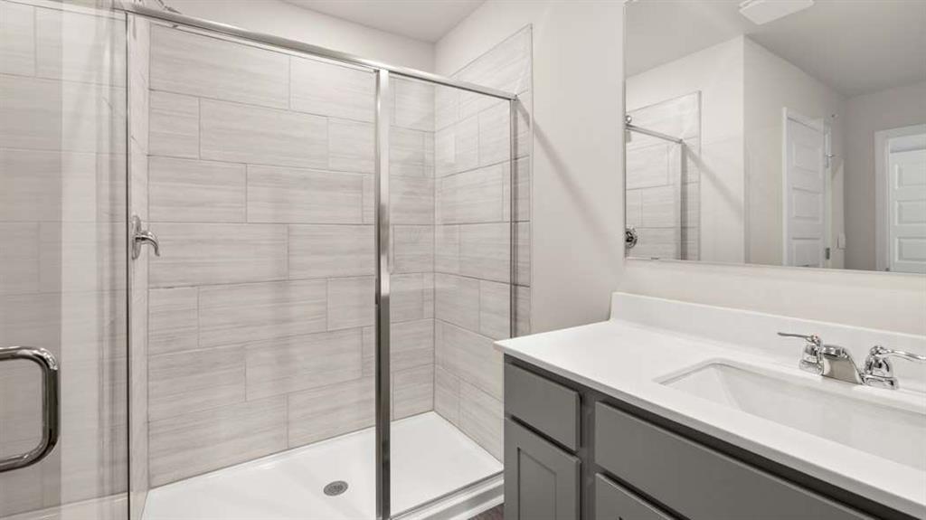 424 Reflection Drive Stockbridge, GA 30281 - Photo 38 of 66 a bathroom with a granite countertop sink a mirror and shower