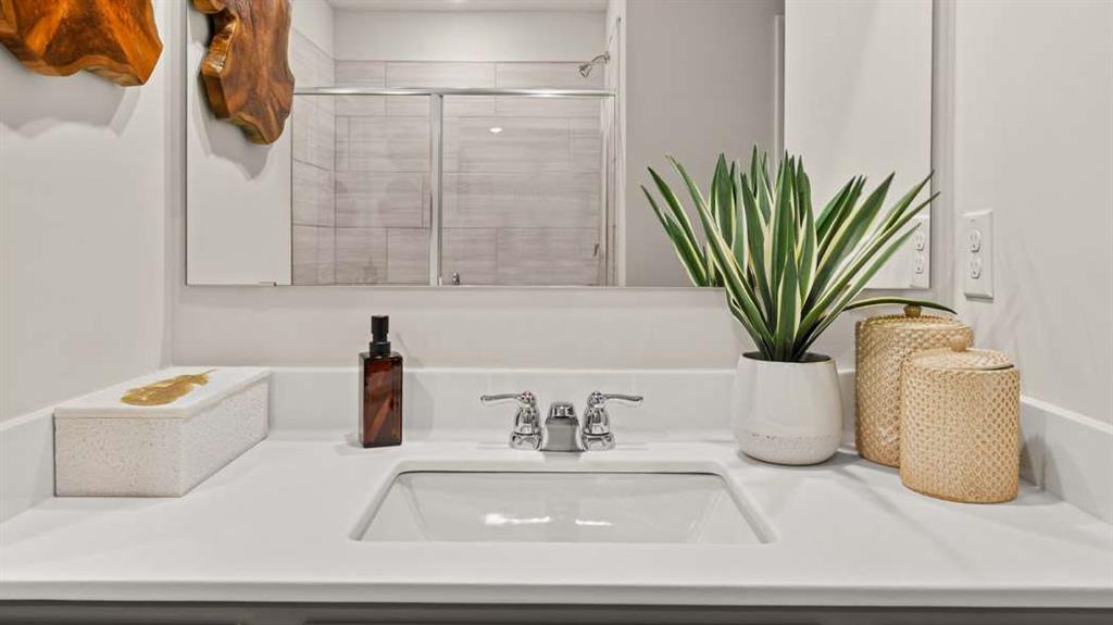 424 Reflection Drive Stockbridge, GA 30281 - Photo 43 of 66 a bathroom with a potted plant and a sink