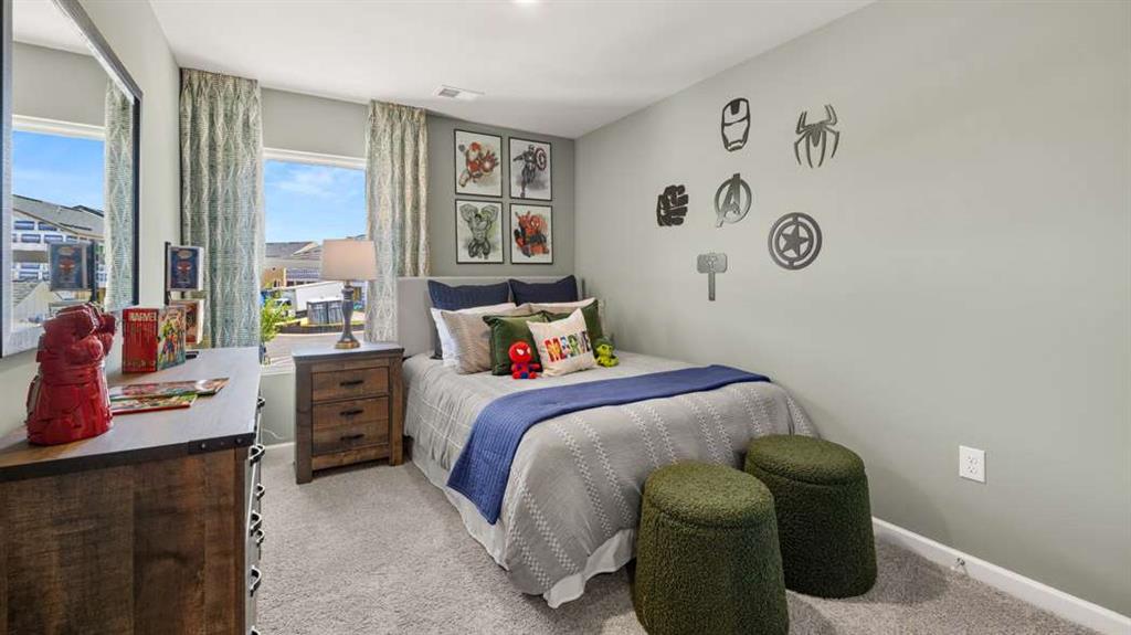 424 Reflection Drive Stockbridge, GA 30281 - Photo 53 of 66 a bedroom with a bed and a window