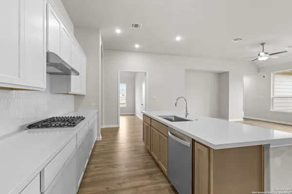 a kitchen with a sink and stove