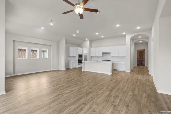 a view of kitchen with refrigerator and window