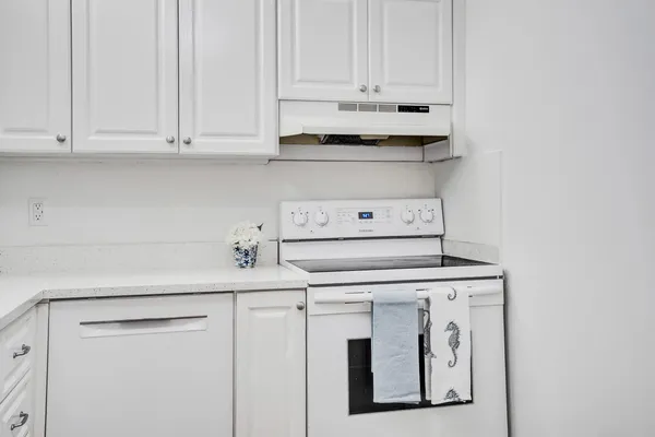 a view of cabinets with sink
