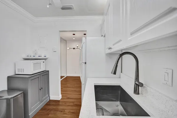 a view of living room with cabinets