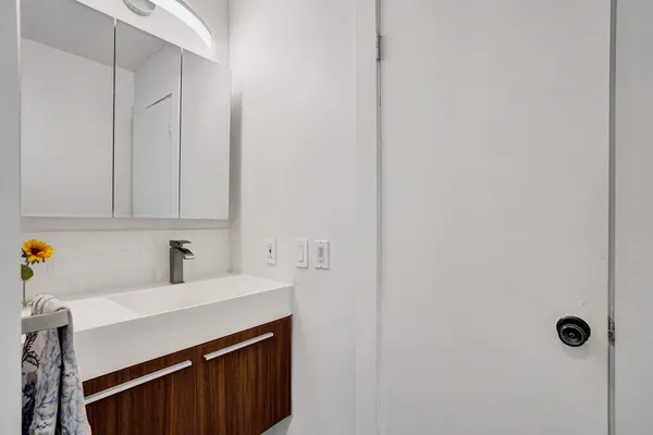 a kitchen with a sink cabinets and utility