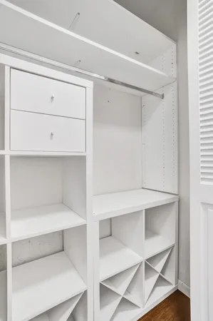 a view of an empty walk in closet