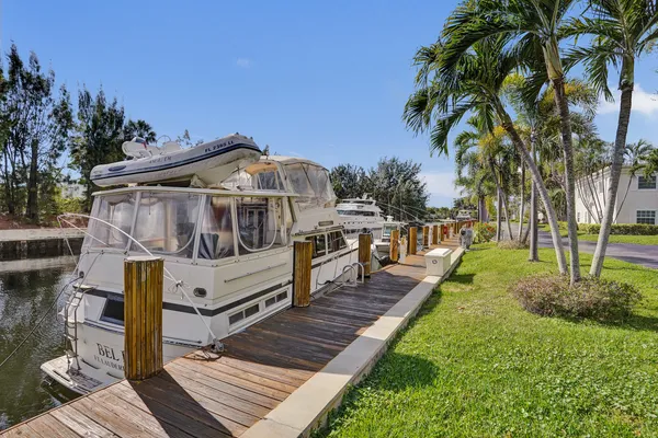 a balcony with wooden floor and lake view