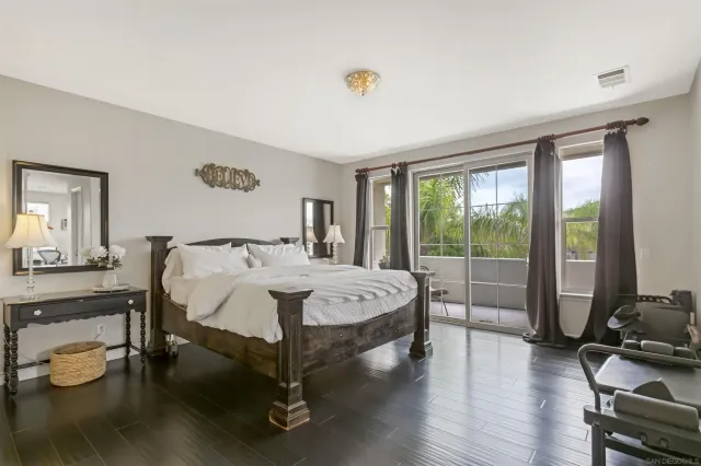 a bed room with a bed and large window