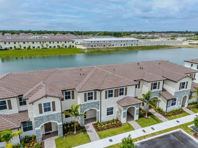 an aerial view of a house with a lake view