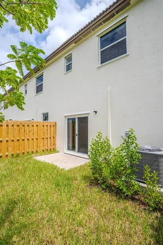 a front view of building with yard