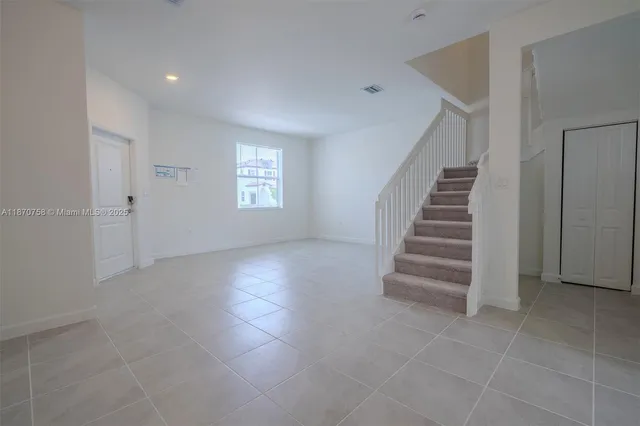 a white toilet sitting next to a bath tub
