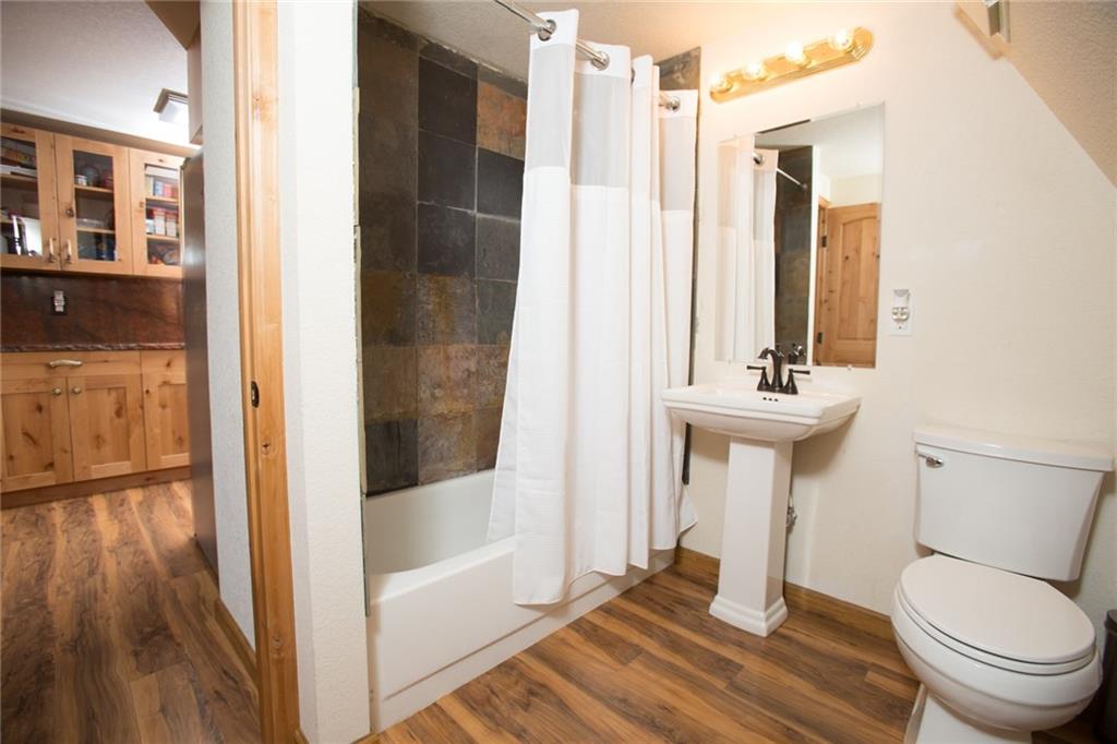 377 Sheep Ridge Road Fairplay, CO 80440 - Photo 19 of 35 a bathroom with a sink a toilet and shower