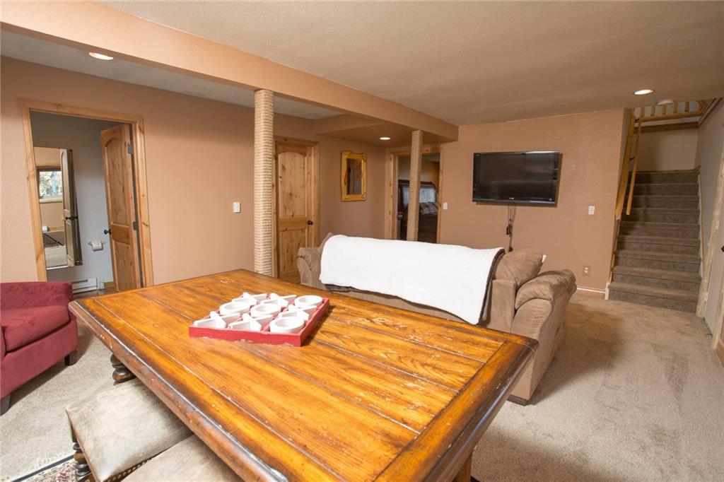 377 Sheep Ridge Road Fairplay, CO 80440 - Photo 24 of 35 a living room with furniture and a flat screen tv