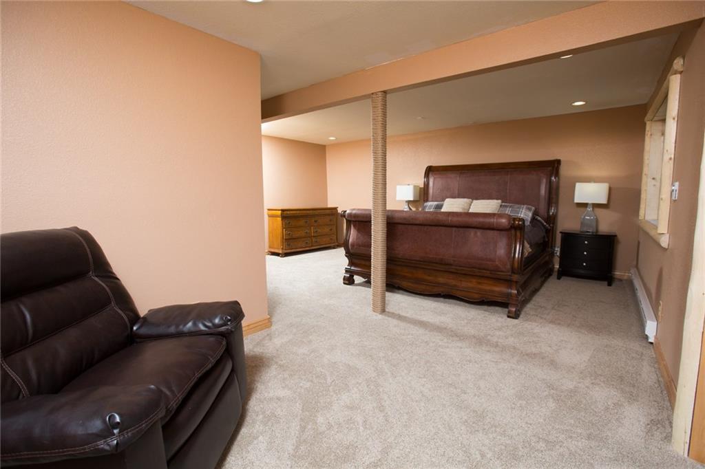 377 Sheep Ridge Road Fairplay, CO 80440 - Photo 28 of 35 a living room with furniture and a flat screen tv