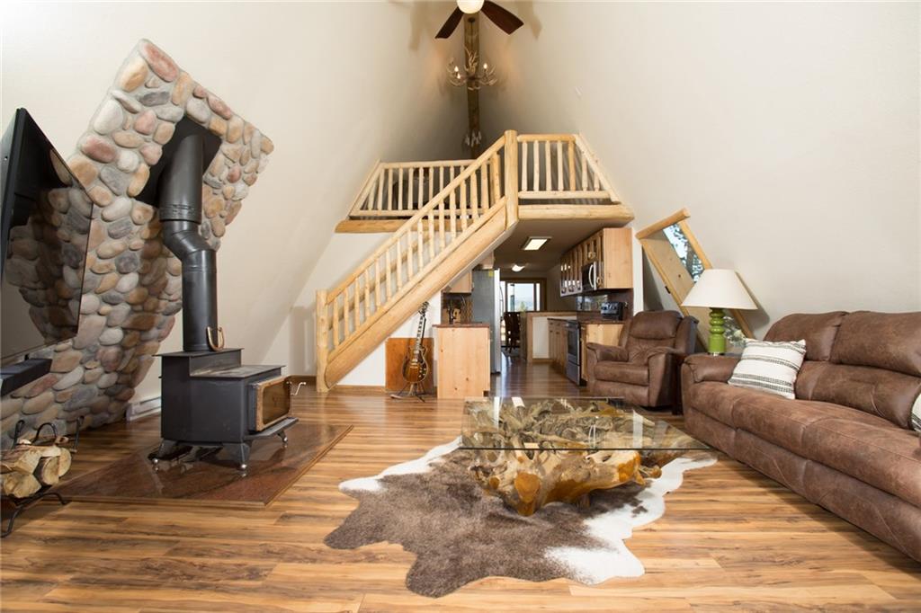 377 Sheep Ridge Road Fairplay, CO 80440 - Photo 6 of 35 a view of a living room with a fireplace