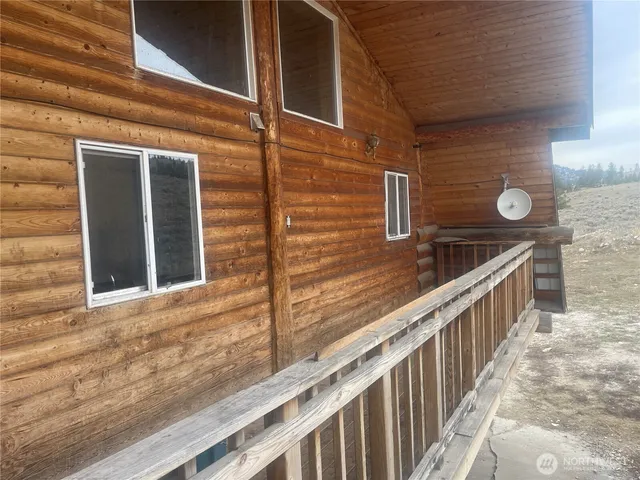 a balcony with wooden floor