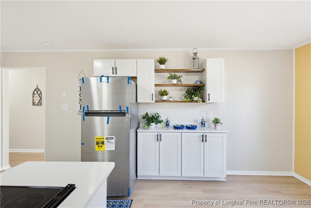 425 Ralph Street Fayetteville, NC 28301 - Photo 17 of 36 a kitchen with stainless steel appliances a refrigerator and a stove