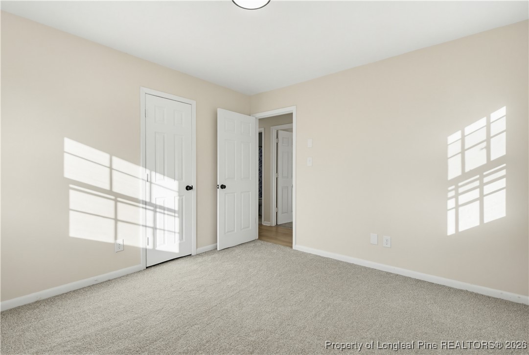 425 Ralph Street Fayetteville, NC 28301 - Photo 27 of 36 an empty room with windows