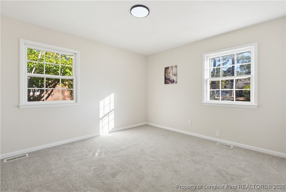 425 Ralph Street Fayetteville, NC 28301 - Photo 28 of 36 an empty room with windows and closet