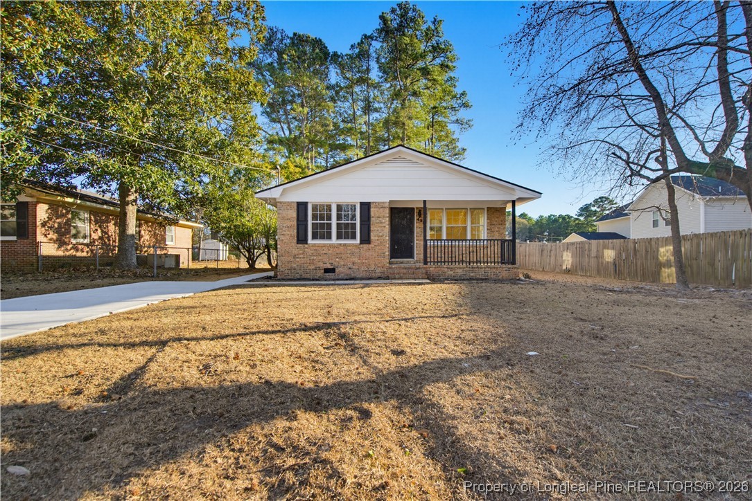 425 Ralph Street Fayetteville, NC 28301 - Photo 3 of 36 a front view of a house with a yard and trees