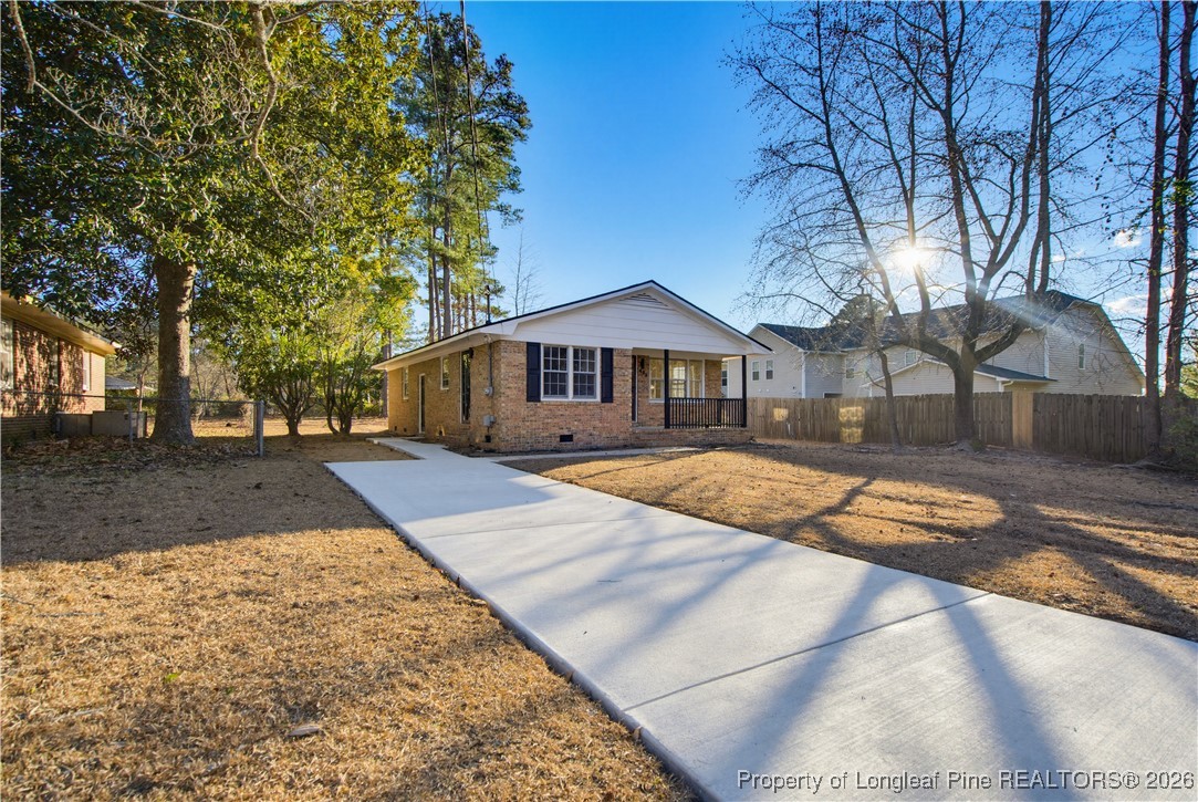 425 Ralph Street Fayetteville, NC 28301 - Photo 4 of 36 a view of swimming pool with trees in the background