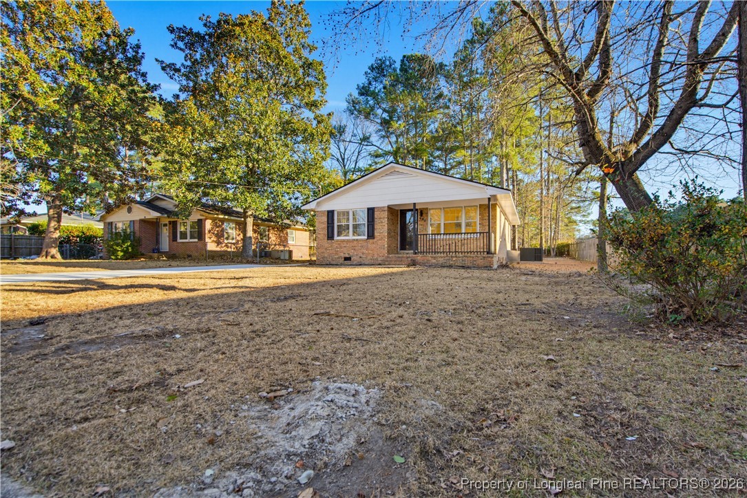 425 Ralph Street Fayetteville, NC 28301 - Photo 5 of 36 a front view of a house with a yard