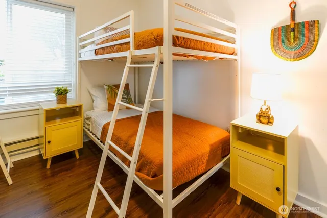 a bed room with a bed and a window