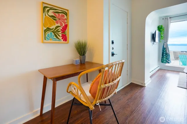 a view of a dining room with furniture and wooden floor