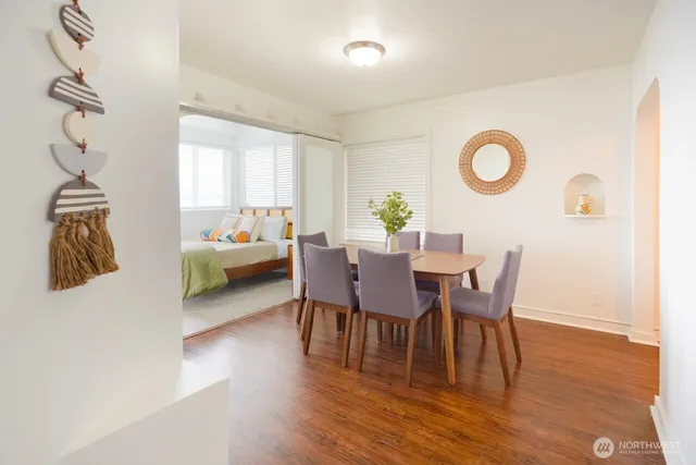 a view of a dining room with furniture and wooden floor