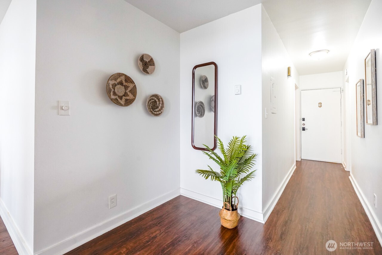 4027 Beach Drive Southwest, Unit 2 Seattle, WA 98116 - Photo 19 of 30 a view of an entryway with wooden floor