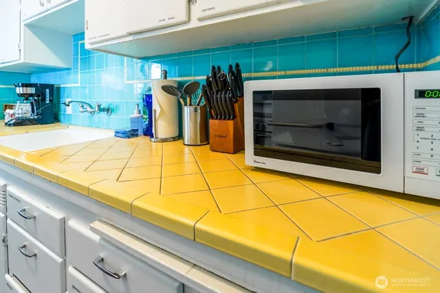 a room with window and a fireplace