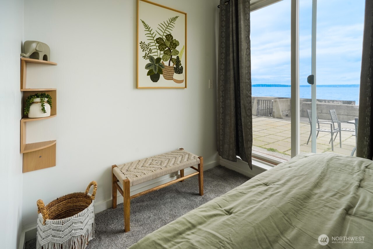 4027 Beach Drive Southwest, Unit 2 Seattle, WA 98116 - Photo 4 of 30 a bedroom with a bed and a window
