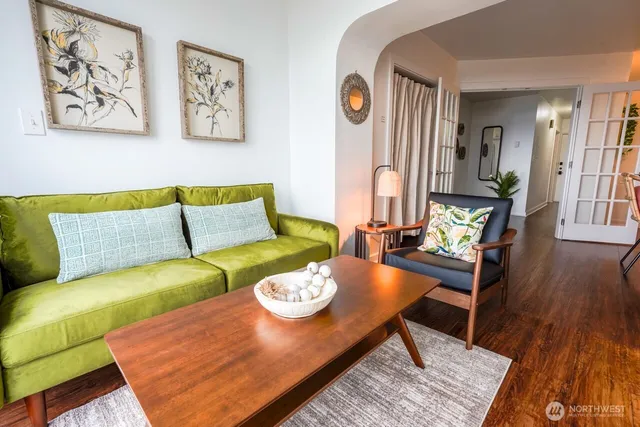 a view of a dining room with furniture and wooden floor