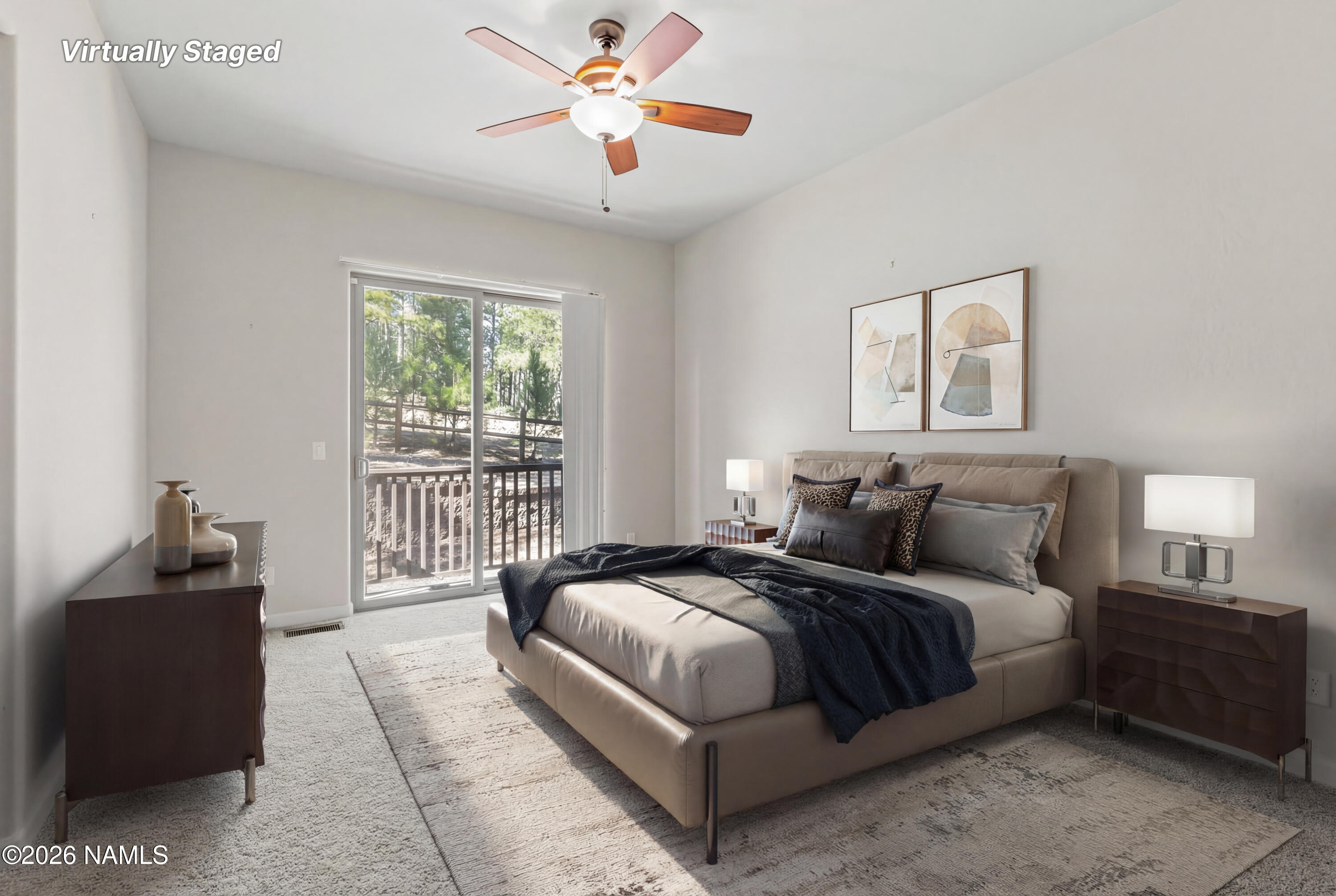 4860 West Quick Draw Flagstaff, AZ 86005 - Photo 11 of 32 a bedroom with a bed and a chandelier