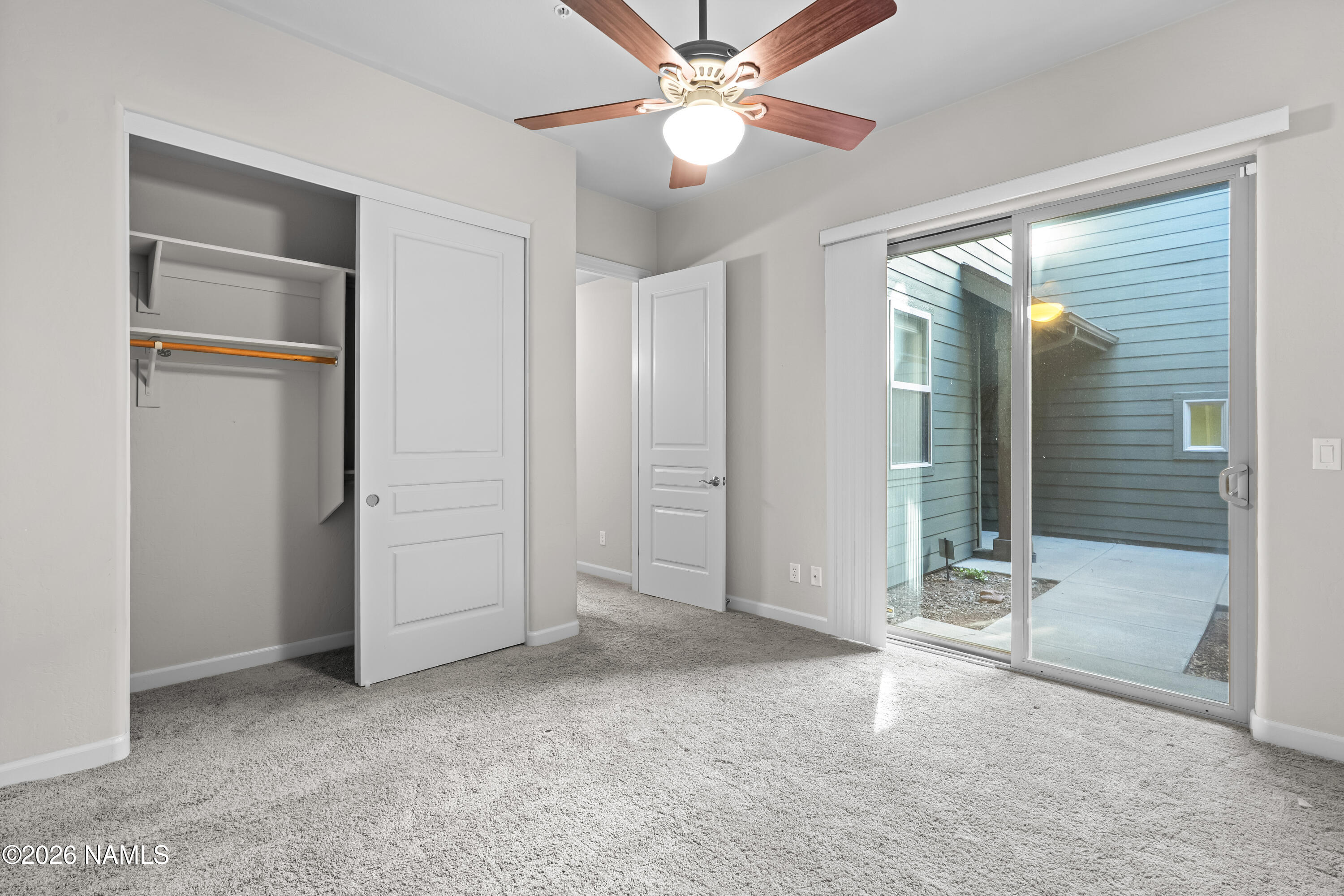 4860 West Quick Draw Flagstaff, AZ 86005 - Photo 18 of 32 an empty room with fan and entrance