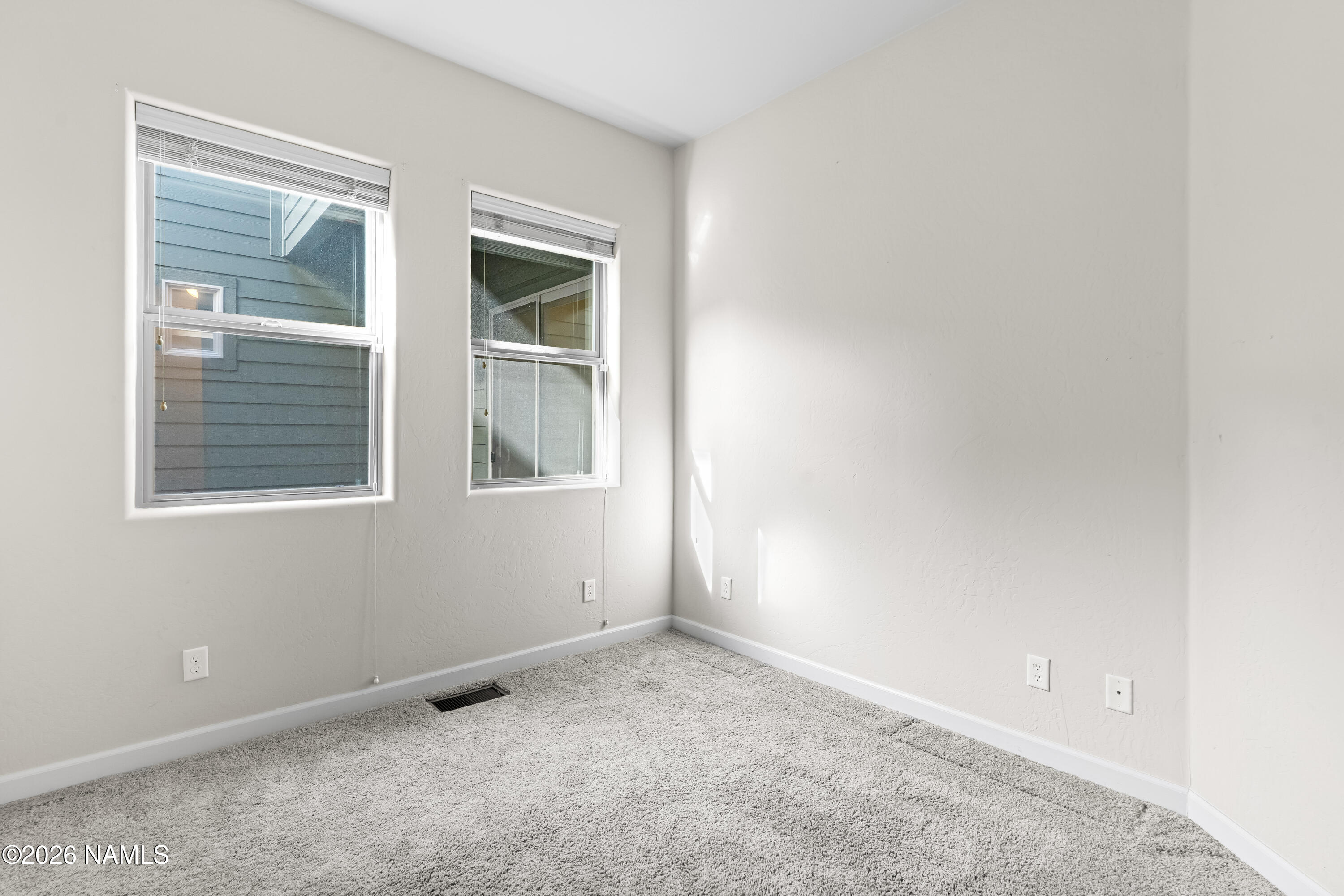 4860 West Quick Draw Flagstaff, AZ 86005 - Photo 21 of 32 an empty room with a window