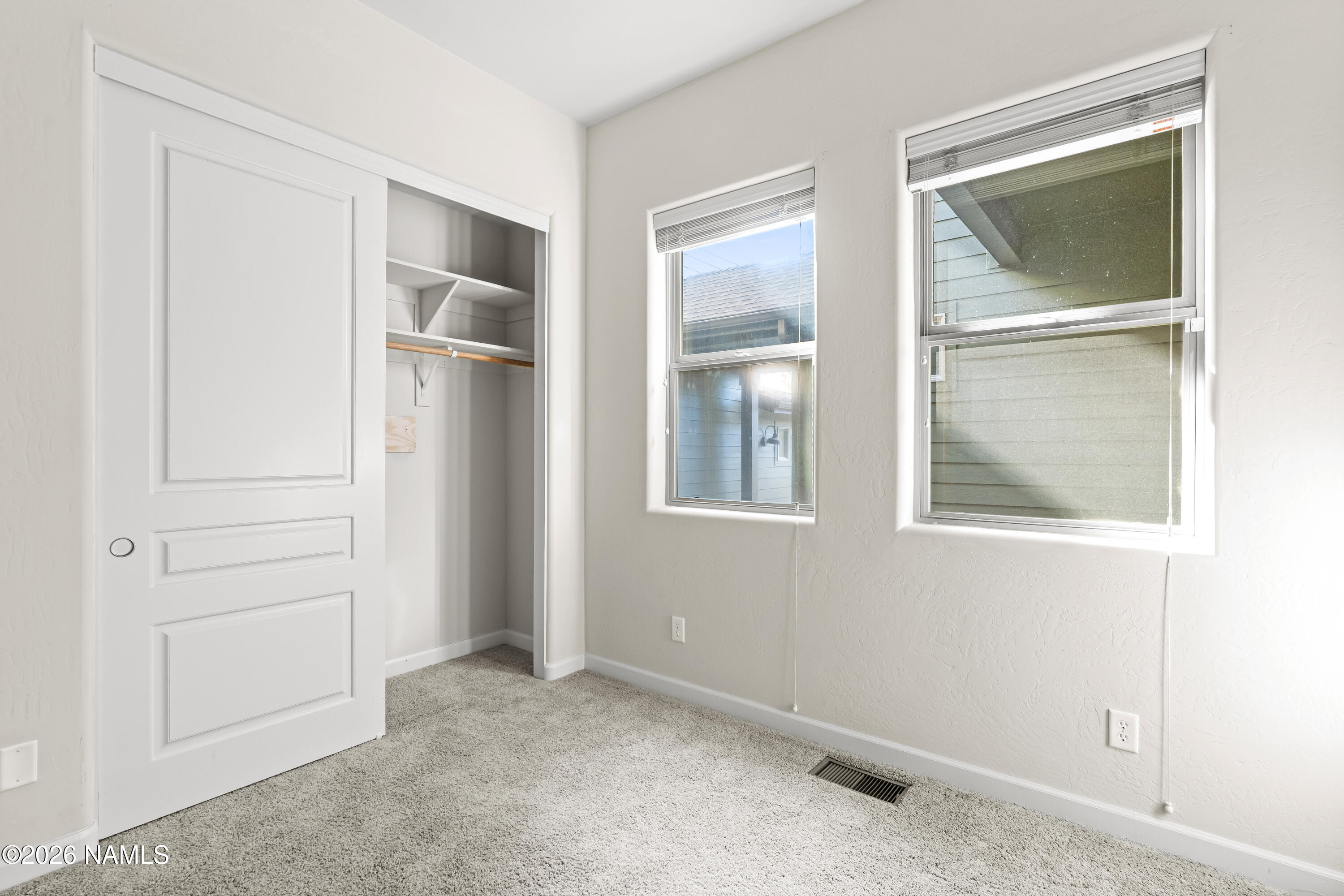 4860 West Quick Draw Flagstaff, AZ 86005 - Photo 22 of 32 an empty room that has a window