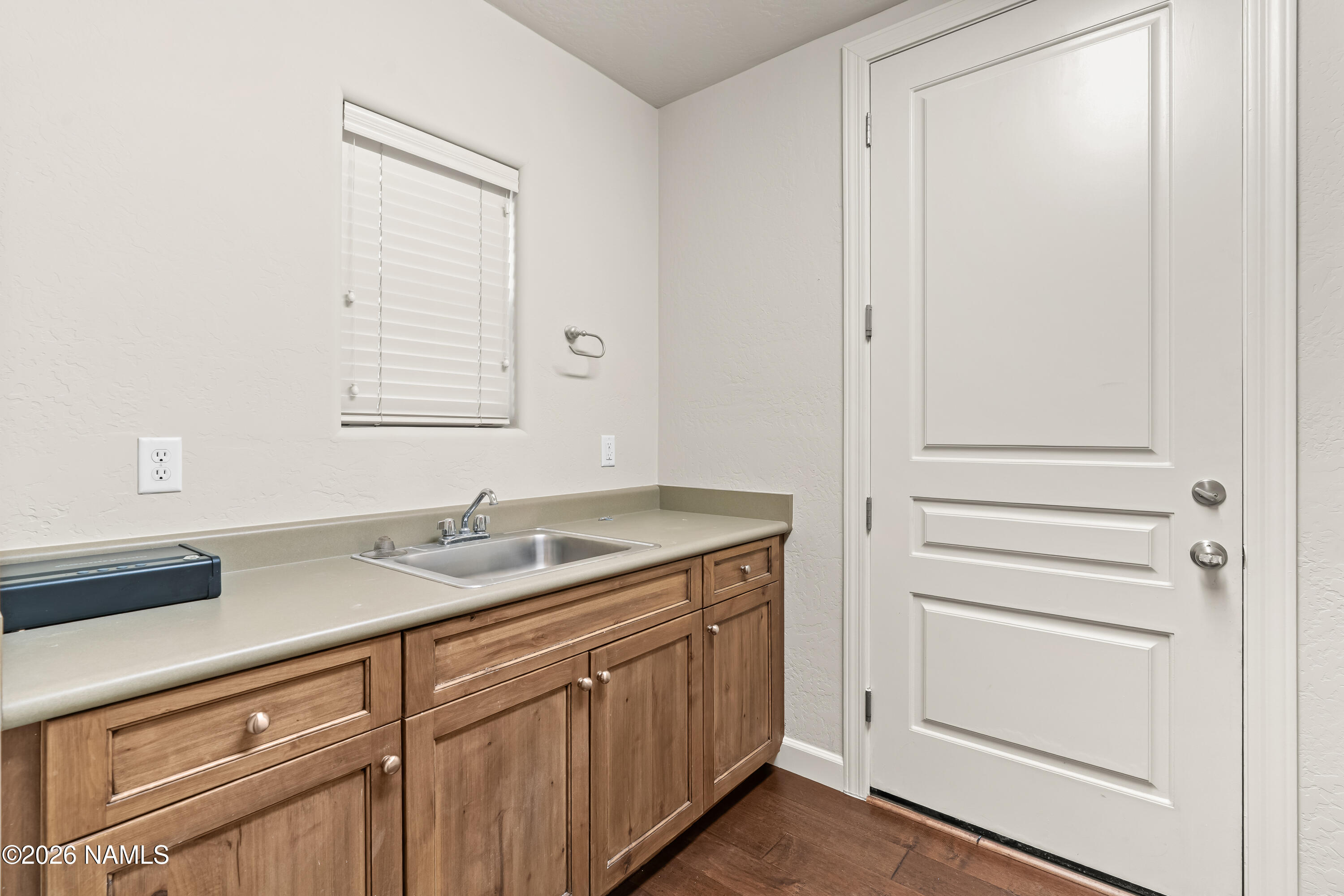 4860 West Quick Draw Flagstaff, AZ 86005 - Photo 23 of 32 a bathroom with a sink and a mirror