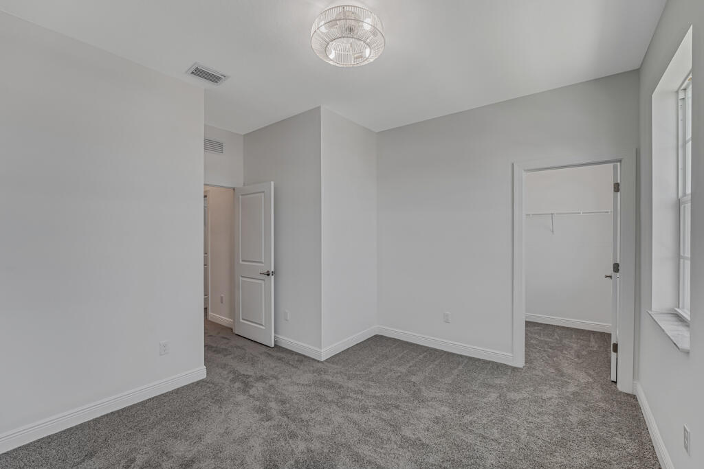 930 Southwest Pr Avenue Palm City, FL 34990 - Photo 27 of 66 a view of an empty room and a window