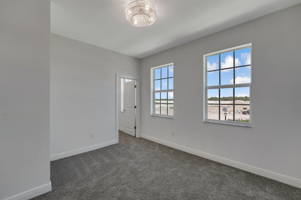 930 Southwest Pr Avenue Palm City, FL 34990 - Photo 28 of 66 an empty room with windows