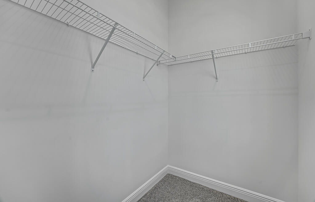930 Southwest Pr Avenue Palm City, FL 34990 - Photo 29 of 66 a view of a room with racks on the wall