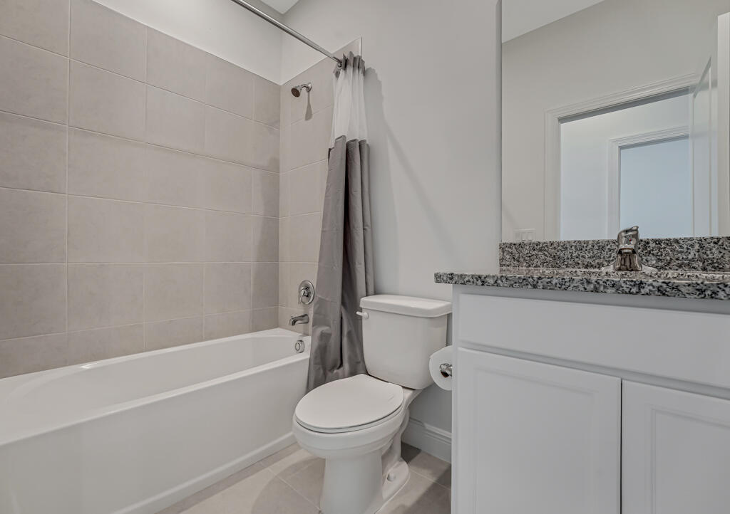 930 Southwest Pr Avenue Palm City, FL 34990 - Photo 30 of 66 a bathroom with a toilet sink and shower