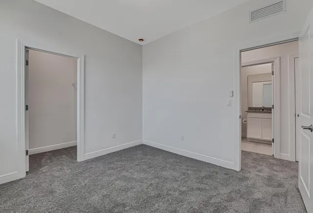 a view of a chair and table in the garden