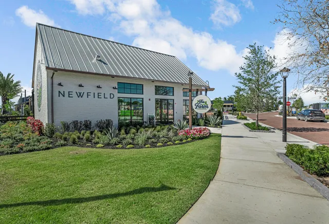 an aerial view of a house with garage