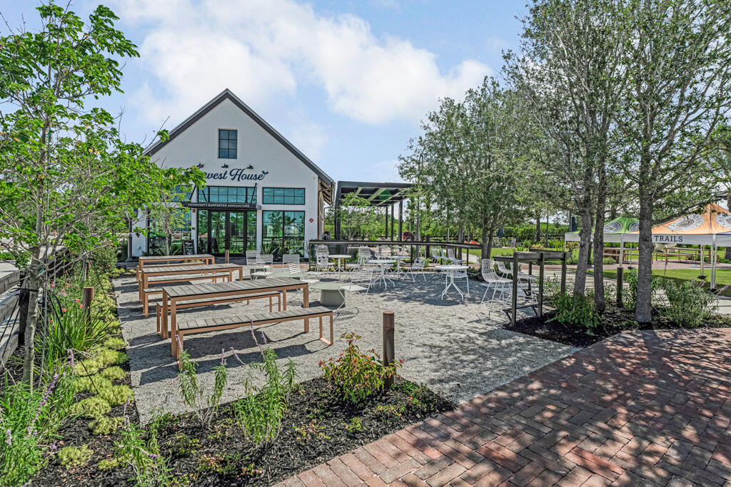 930 Southwest Pr Avenue Palm City, FL 34990 - Photo 40 of 66 a front view of a house with a garden