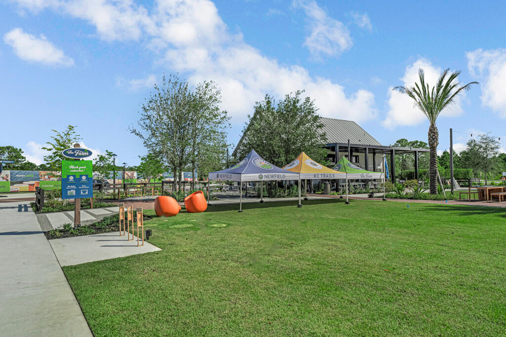 930 Southwest Pr Avenue Palm City, FL 34990 - Photo 41 of 66 a front view of a house with garden