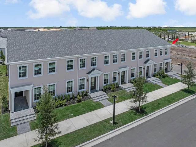 an aerial view of a house with a swimming pool